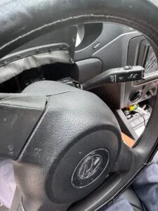 Volkswagen dashboard and steering column disassembled for ignition switch repair in Chicago