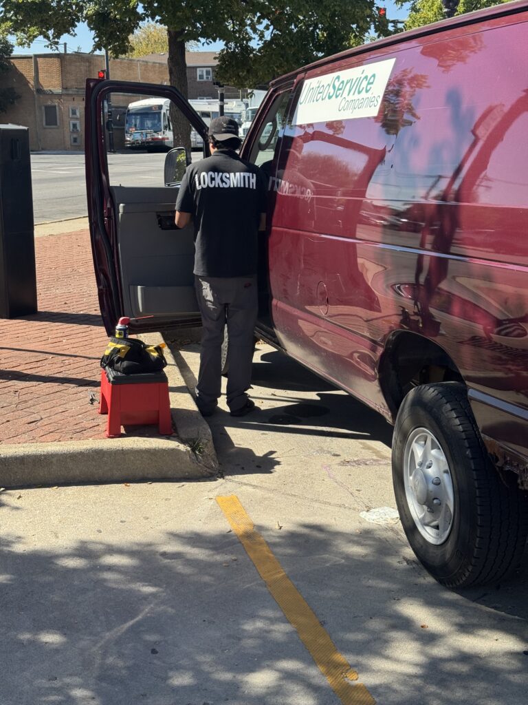 Locksmith working on a 2012 Ford Econoline door lock cylinder in Summit, Illinois